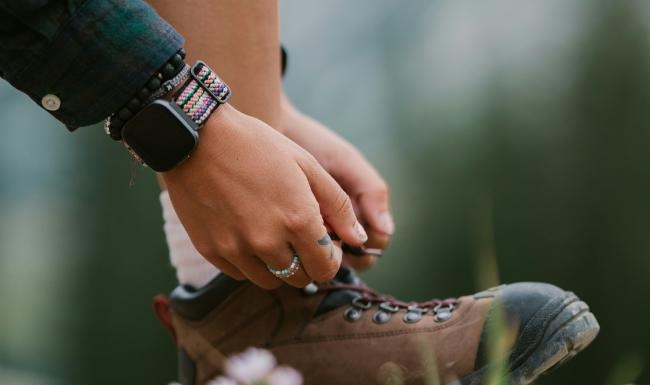 a person tying a shoe