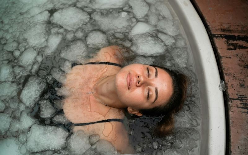 a person submerged in an ice bath