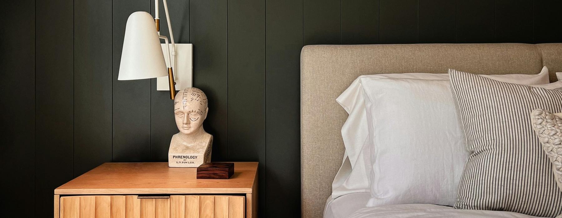 a bedroom with a bed and a desk